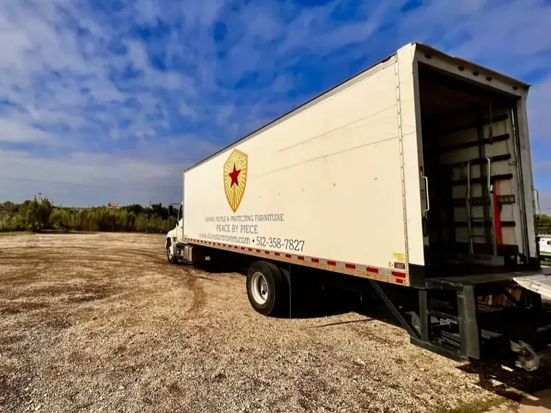 Elite Star Movers box truck with its rear door open, ready for a long-distance load